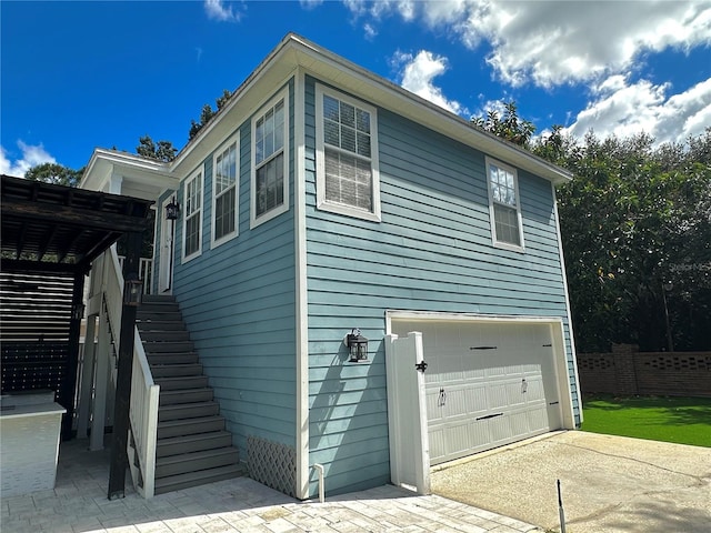 view of property exterior with a garage