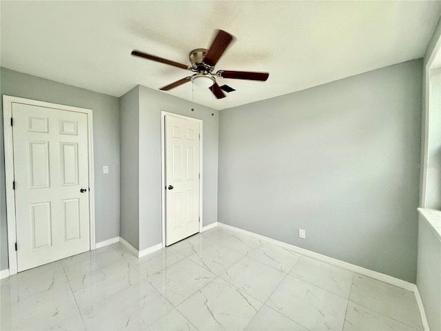 unfurnished bedroom featuring ceiling fan, a closet, and a textured ceiling