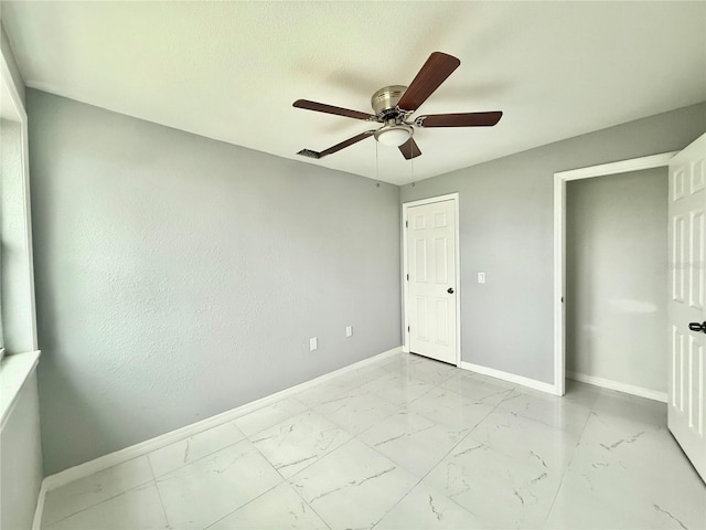 unfurnished bedroom featuring ceiling fan