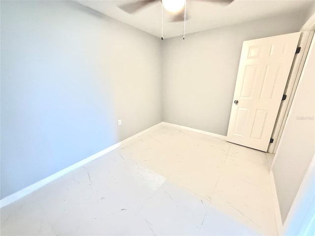 spare room with ceiling fan