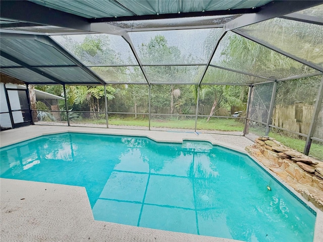 view of pool with a lanai