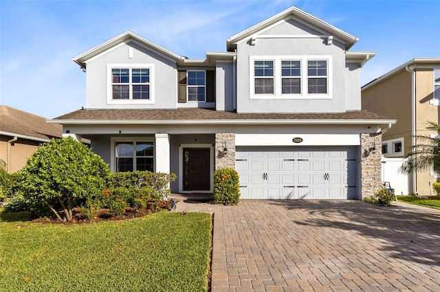 view of front facade with a garage and a front yard