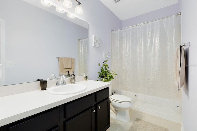 full bathroom with toilet, vanity, tile patterned floors, and shower / tub combo