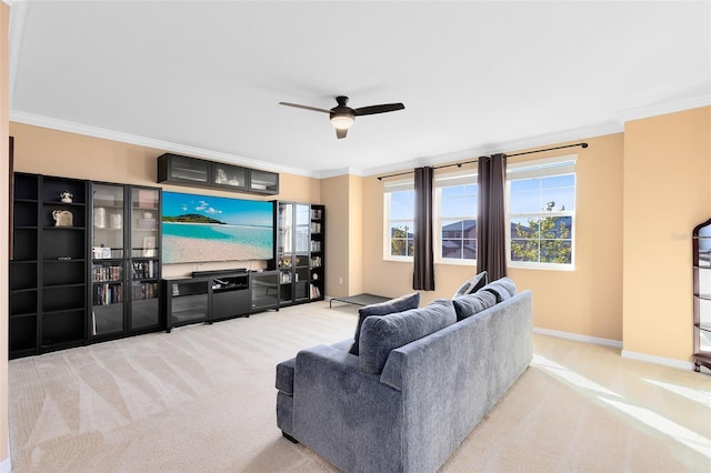 living room with light colored carpet, ceiling fan, and crown molding