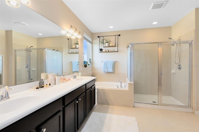 bathroom with vanity, tile patterned floors, and separate shower and tub