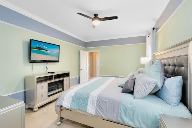 carpeted bedroom with ceiling fan and crown molding