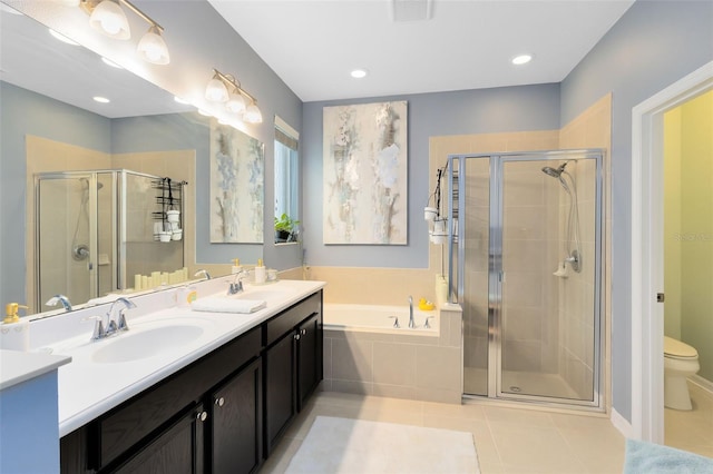 full bathroom with tile patterned flooring, vanity, toilet, and plus walk in shower