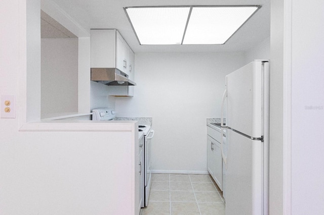 kitchen featuring electric stove, white refrigerator, light tile patterned flooring, and white cabinetry