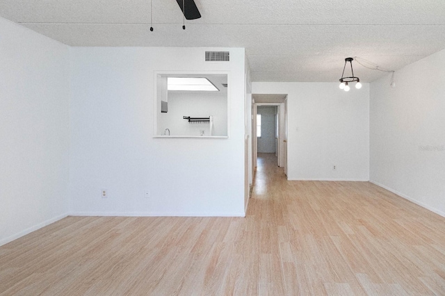 empty room with light wood-type flooring