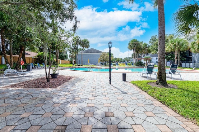 view of swimming pool with a patio