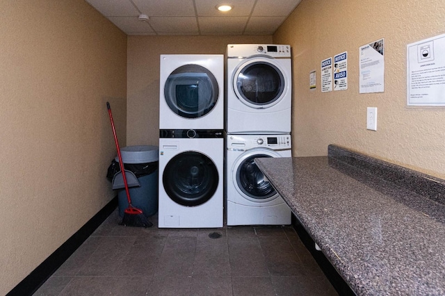 laundry room featuring stacked washer / drying machine and washer and clothes dryer