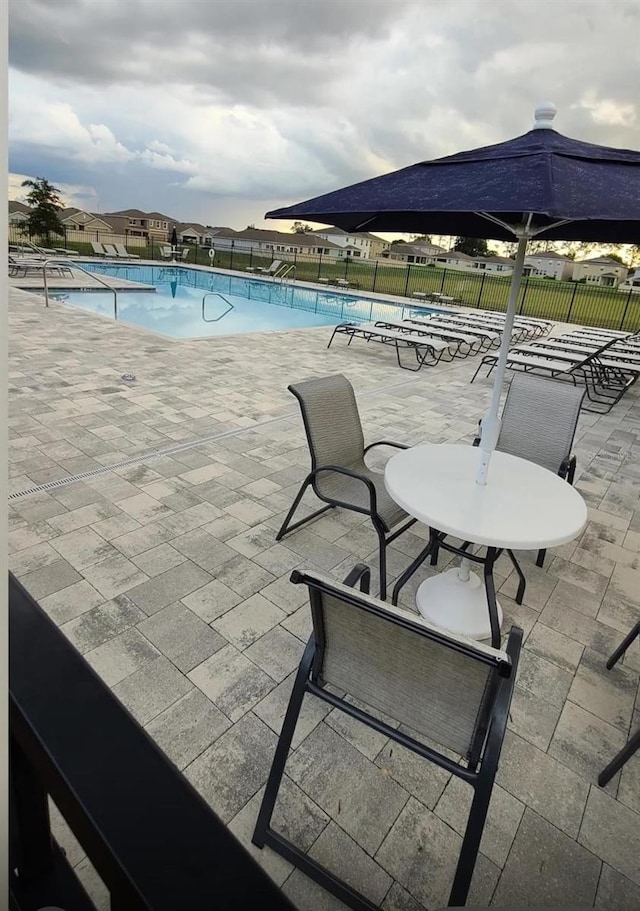 view of swimming pool with a patio