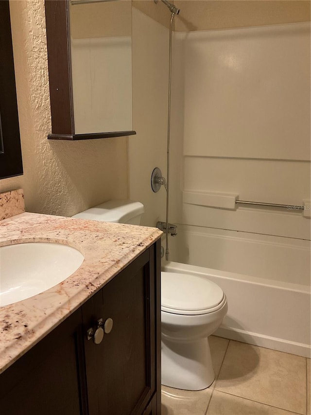 full bathroom featuring vanity, tile patterned flooring, toilet, and tub / shower combination