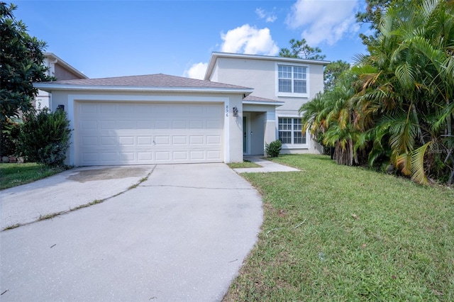 view of front of house featuring a front yard and a garage