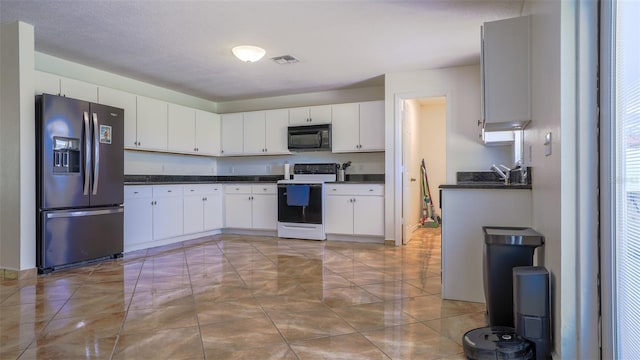 kitchen with white cabinets, a textured ceiling, fridge with ice dispenser, and white range with electric stovetop