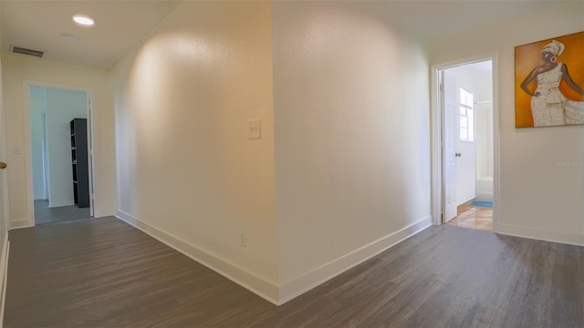 hall with dark hardwood / wood-style floors