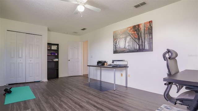 office with a textured ceiling, dark hardwood / wood-style floors, and ceiling fan