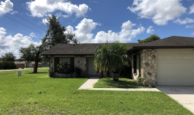 single story home with a front yard and a garage