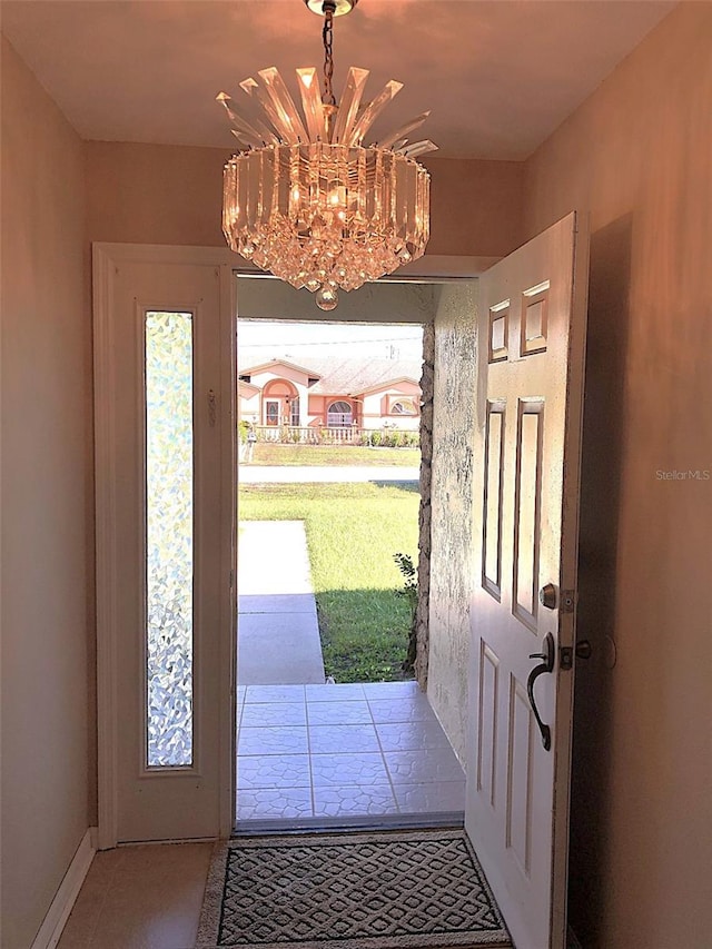 doorway with a chandelier