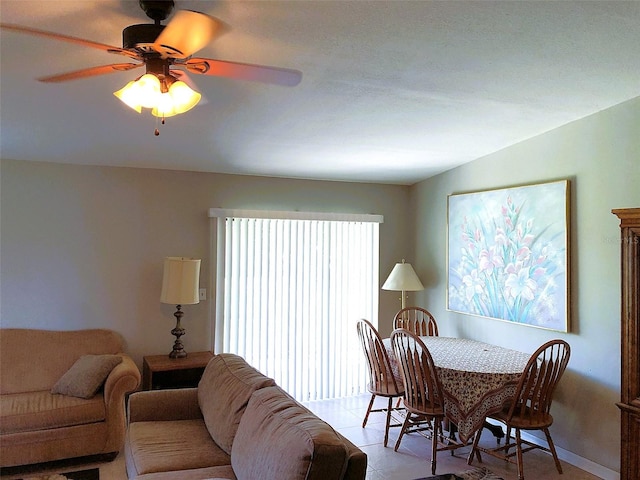 dining area featuring light tile patterned floors and ceiling fan