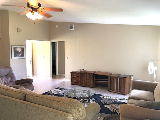 tiled living room with lofted ceiling and ceiling fan