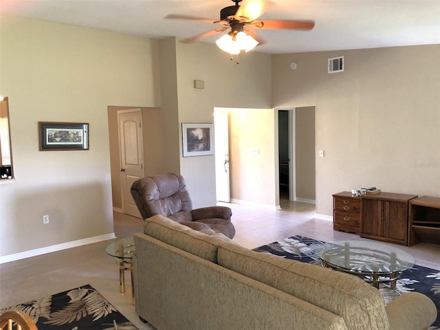 tiled living room featuring lofted ceiling and ceiling fan