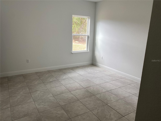 spare room with light tile patterned floors