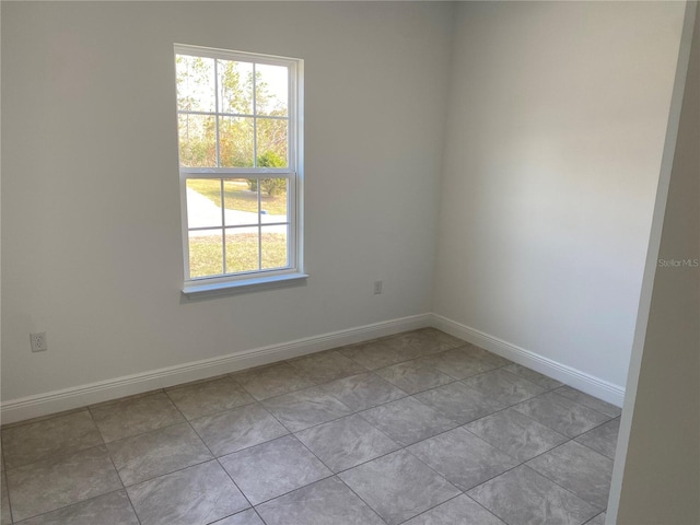 empty room with light tile patterned floors