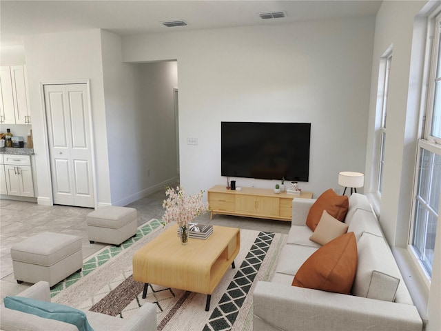 living room featuring light tile patterned flooring