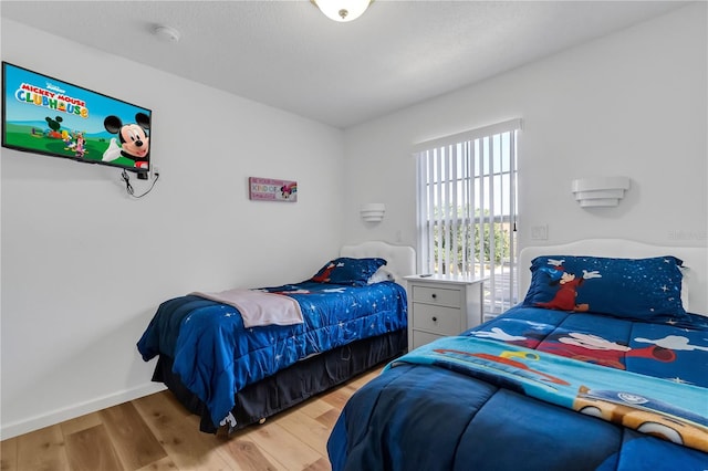 bedroom featuring hardwood / wood-style floors