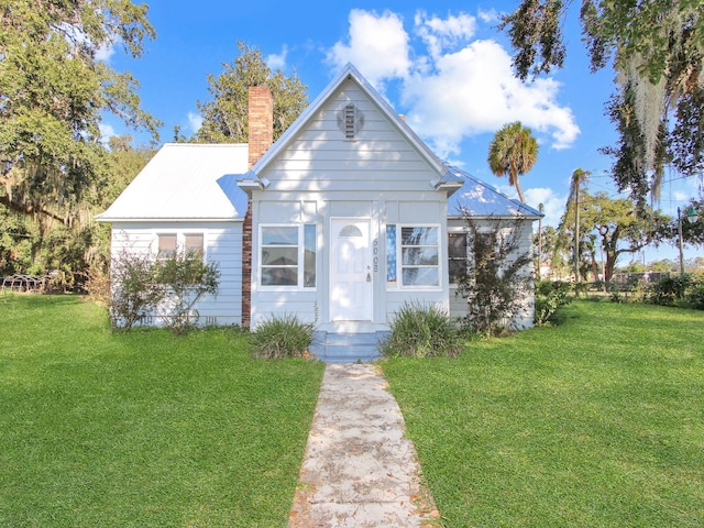 bungalow-style house with a front lawn