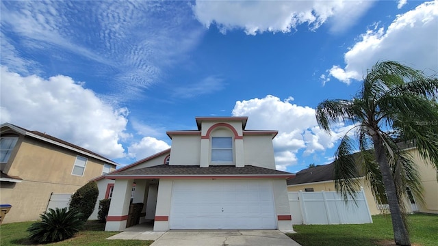 front of property featuring a garage and a front lawn