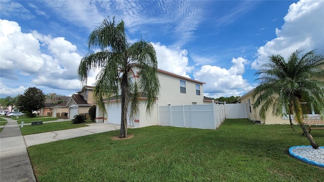 view of home's exterior featuring a yard and a garage