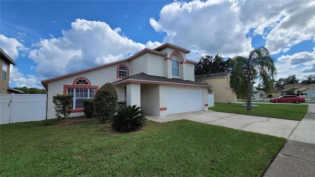 view of front of house featuring a front lawn and a garage