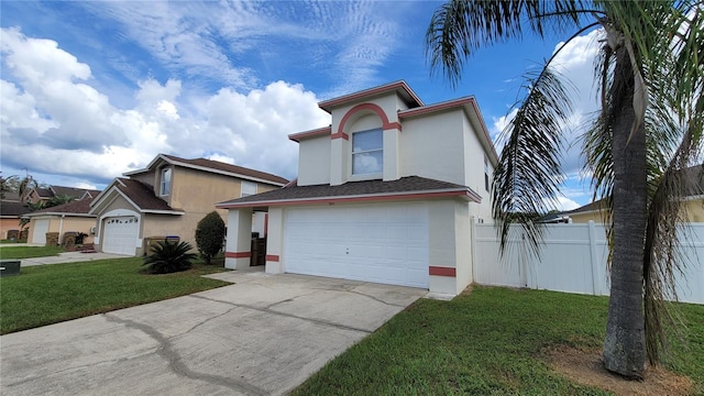 view of front of property featuring a garage and a front lawn