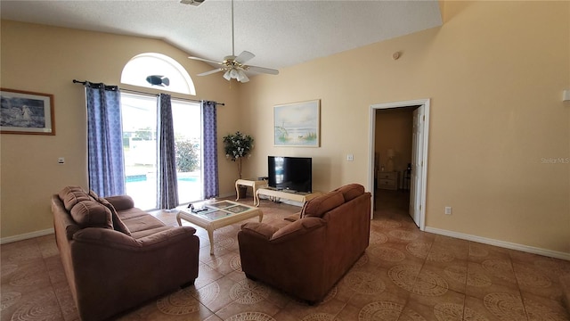 tiled living room featuring ceiling fan, a textured ceiling, and high vaulted ceiling