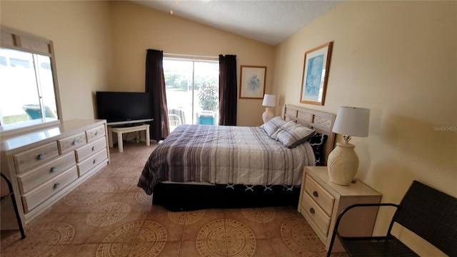 bedroom featuring lofted ceiling