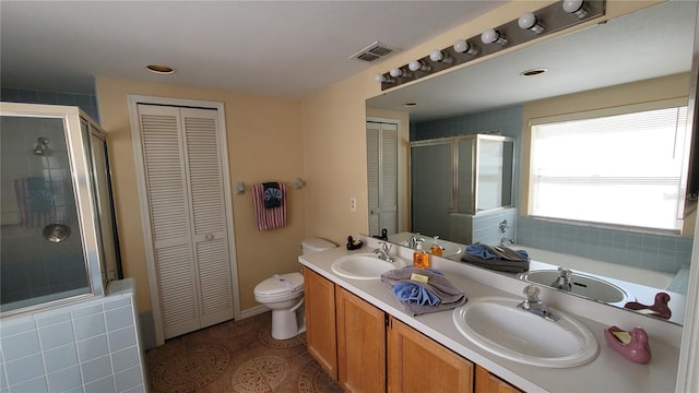 full bathroom featuring tile patterned flooring, separate shower and tub, vanity, and toilet