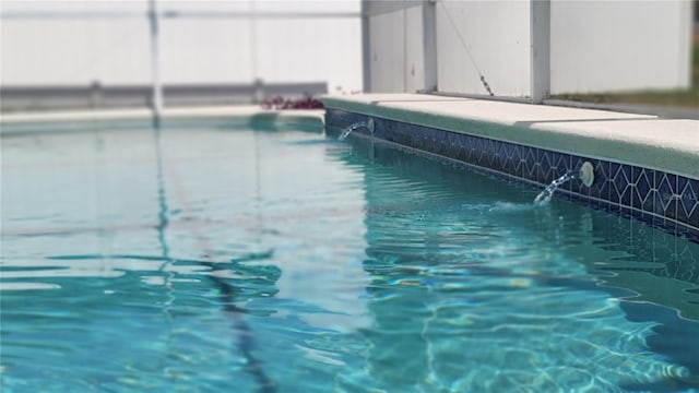 view of pool featuring pool water feature