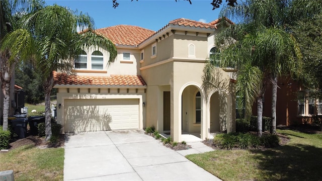 mediterranean / spanish-style house featuring a garage