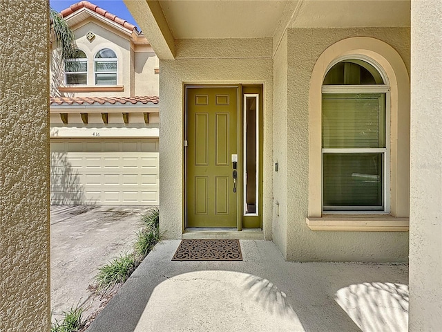 property entrance with a garage