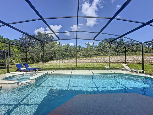 416 Orange Cosmos Blvd, Davenport, FL 33837 - view of swimming pool featuring a pool with connected hot tub, glass enclosure, and a lawn
