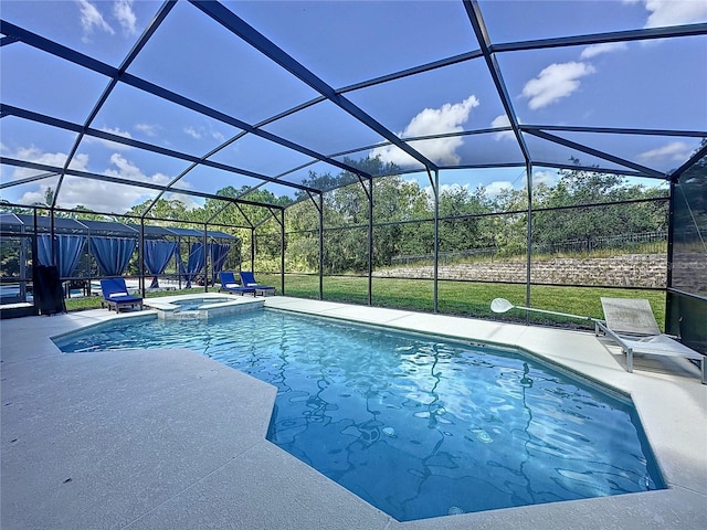 view of swimming pool featuring an in ground hot tub, a lanai, and a patio area