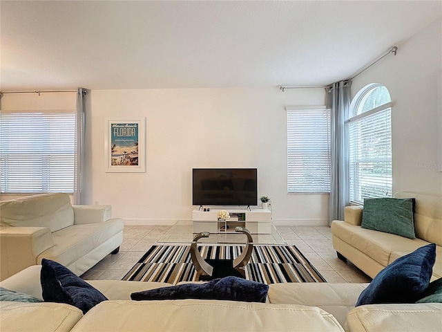 living room with light tile patterned flooring