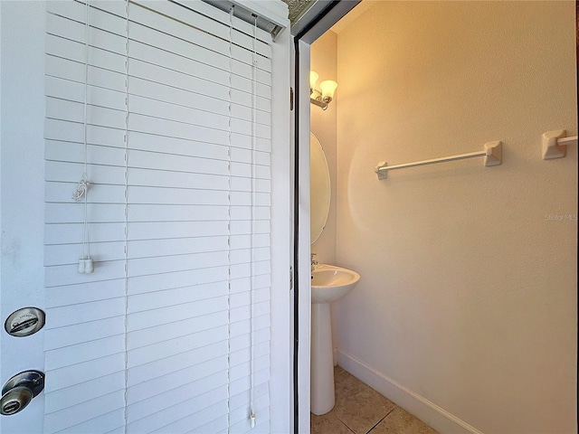 bathroom with tile patterned floors