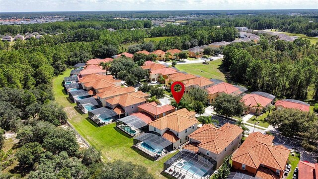 416 Orange Cosmos Blvd, Davenport, FL 33837 - aerial view of residential area featuring a forest