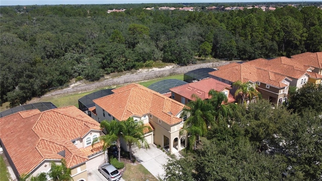 416 Orange Cosmos Blvd, Davenport, FL 33837 - aerial perspective of suburban area with a forest