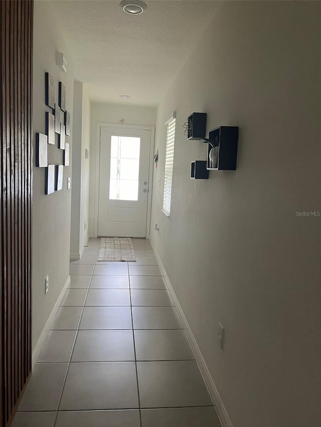 doorway featuring light tile patterned floors