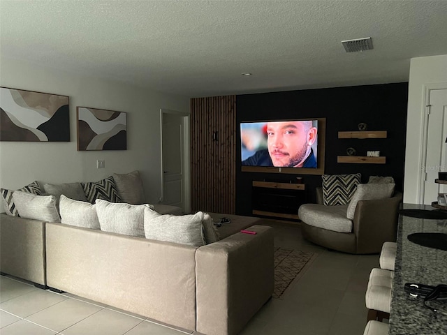 tiled living room with a textured ceiling