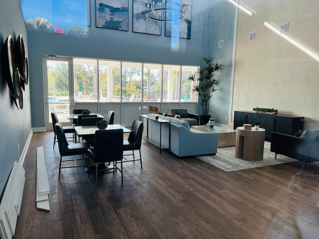 dining area with dark hardwood / wood-style floors